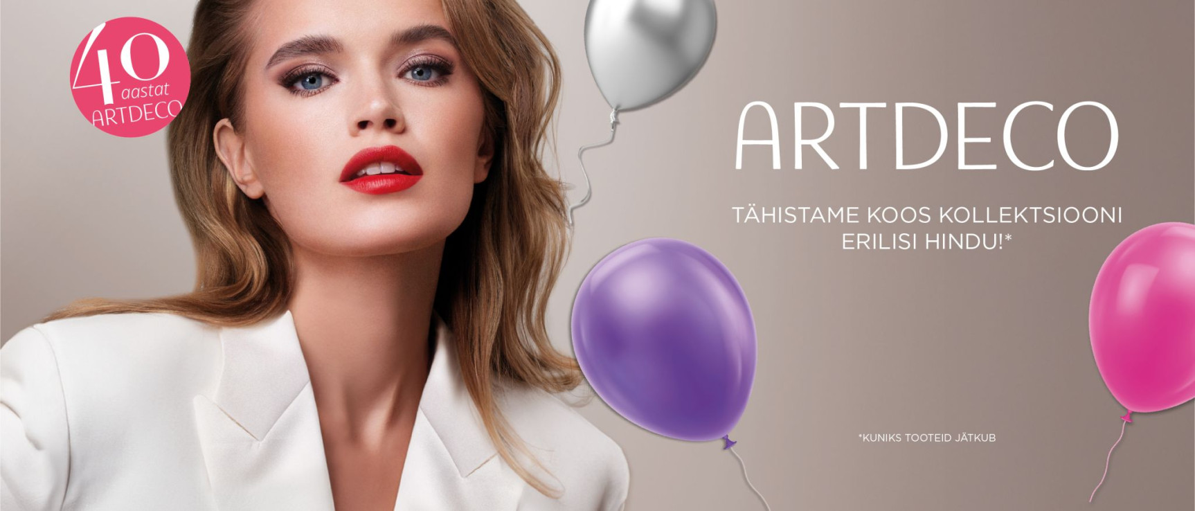 ARTDECO tähistab 40. juubelit –  Elegantne naine värviliste õhupallidega.