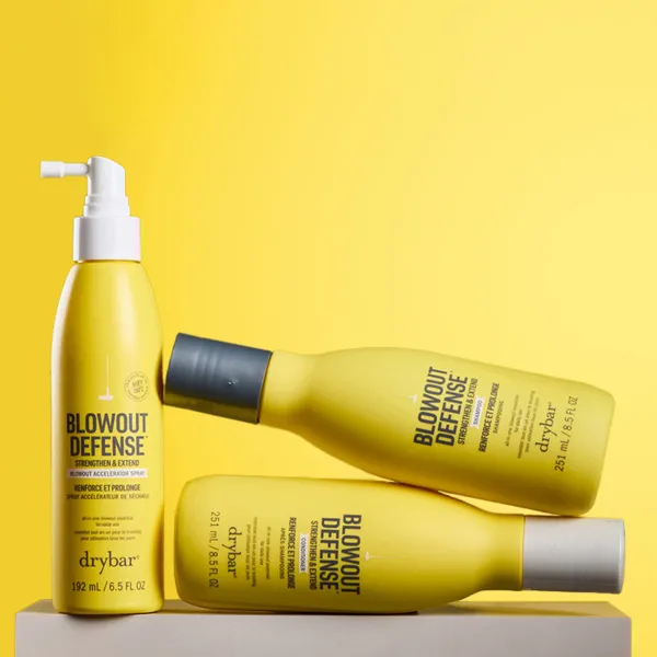 Drybar Blowout Defense juuksehooldustooted kollasel taustal.